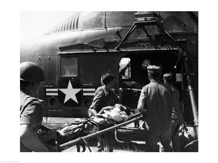 Army soldiers carrying an injured person in a helicopter art print