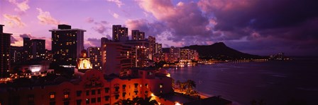 Buildings lit up at dusk, Waikiki, Oahu, Hawaii, USA by Panoramic Images art print