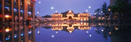 Buildings in an amusement park lit up at dusk, Tivoli Gardens, Copenhagen, Denmark by Panoramic Images art print