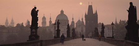 Charles Bridge at dusk with the Church of St. Francis in the background, Old Town Bridge Tower, Prague, Czech Republic by Panoramic Images art print