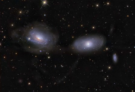 Gravitionaly distorted Galaxies NGC 3169 and NGC 3166 by Ken Crawford/Stocktrek Images art print