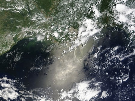 Satellite view of Streaks and Ribbons of Oil Brighten the Reflection of the Sun off the Gulf of Mexico by Stocktrek Images art print