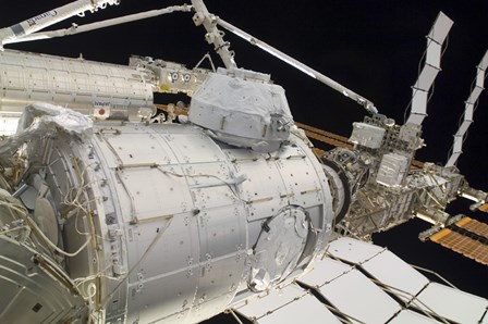The Pressurized Mating Adapter 3 in the Grasp of the Canadarm2 by Stocktrek Images art print