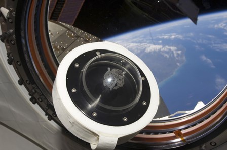 A moon rock floats aboard the International Space Station by Stocktrek Images art print